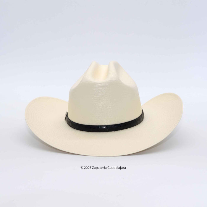 A cream-colored woven cowboy hat with a black band around the crown, photographed against a light gray background.