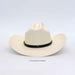 A cream-colored woven cowboy hat with a black band around the crown, photographed against a light gray background.