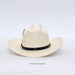 An off-white woven cowboy hat with a black band around the crown, photographed against a plain white background.