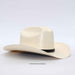 A cream-colored woven cowboy hat with a black band and small geometric embroidery on the side, displayed on a light gray background.