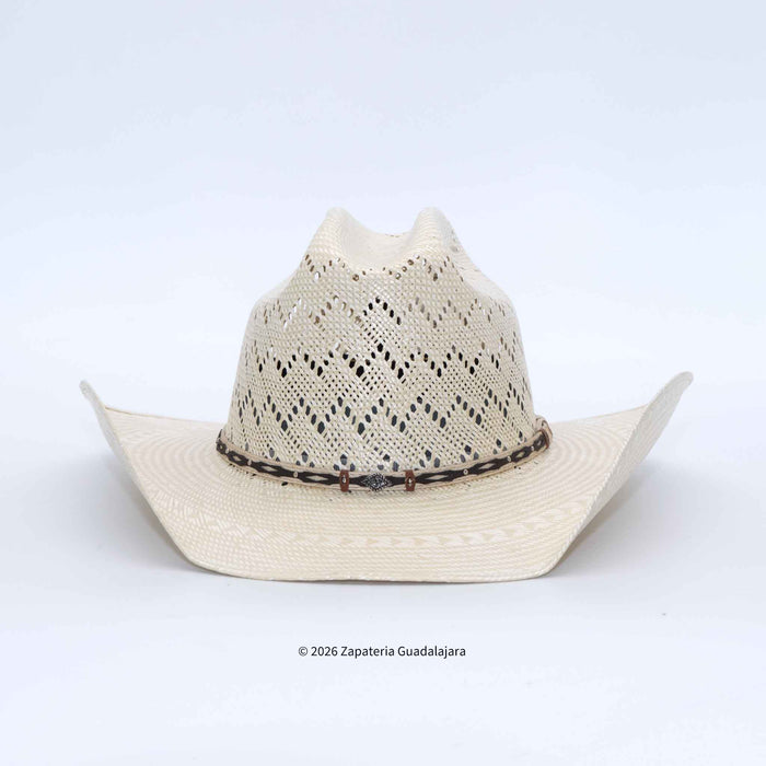 A light beige woven straw cowboy hat with a decorative dark band and a small central emblem, photographed against a clean white background.