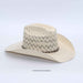 A light beige woven straw cowboy hat with a textured, openwork pattern on the crown and a dark brown band around the base, shown on a white background.
