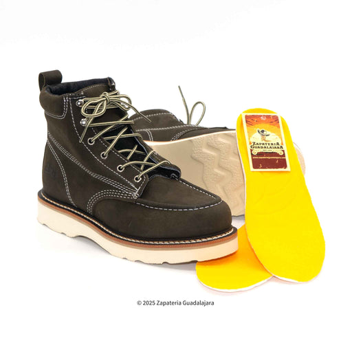 Brown leather boot with yellow insole on a white background
