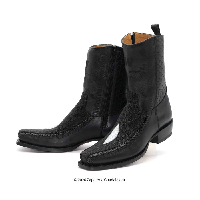 Pair of black leather boots on a white background