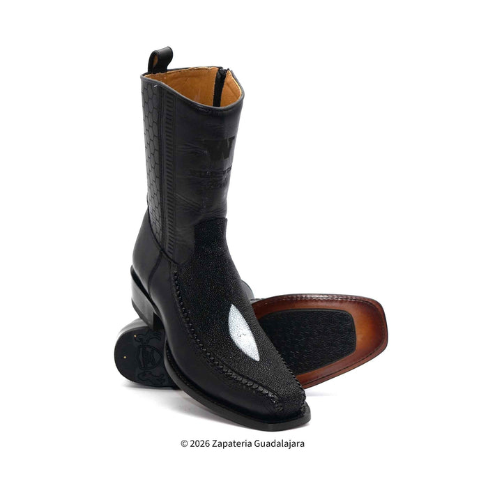 Black leather boot with brown sole on a white background
