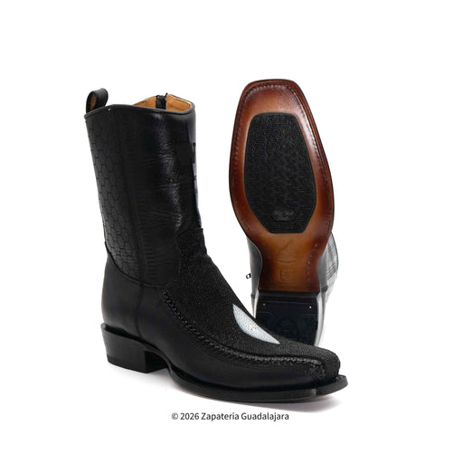 Black leather boot with brown heel on a white background