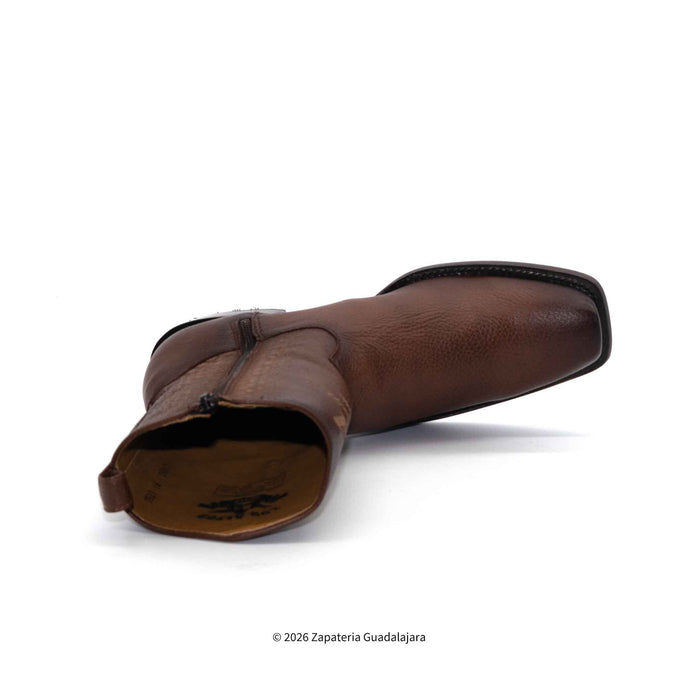 Brown leather boot on a white background