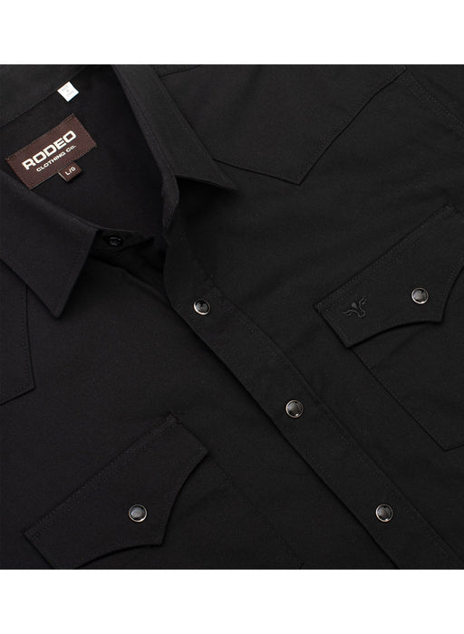 Black shirt with button details and a visible brand tag on a white background