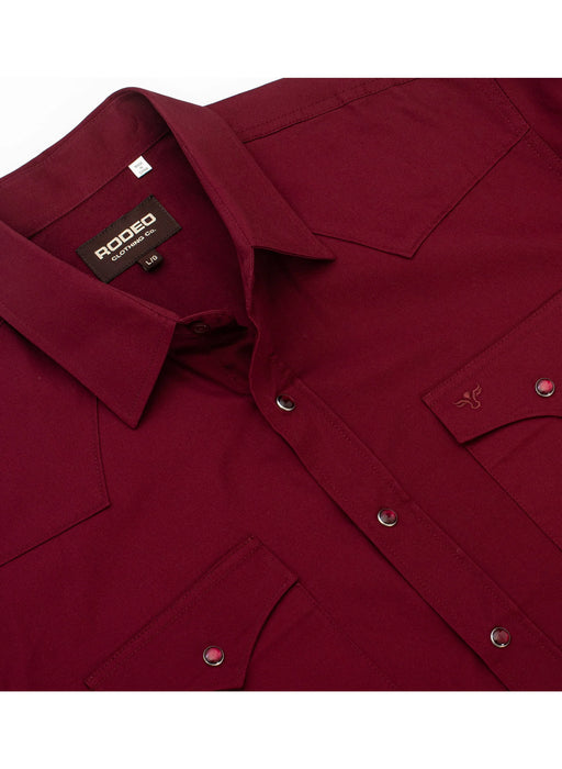 Close-up of a burgundy shirt with a Rodeo brand label on a white background