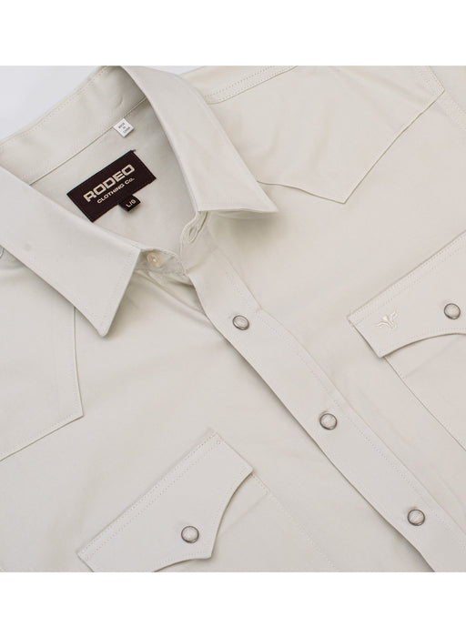 Beige shirt with a brand label on a white background