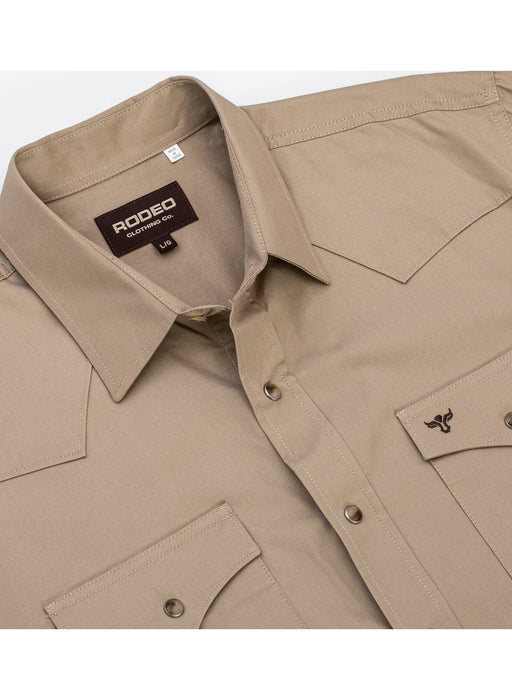 Beige shirt with Rodeo USA label on a white background