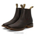 Pair of brown leather boots with elastic sides on a white background
