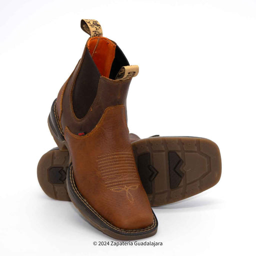 Brown leather boots on a white background