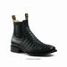 a pair of black cayman belly leather boots