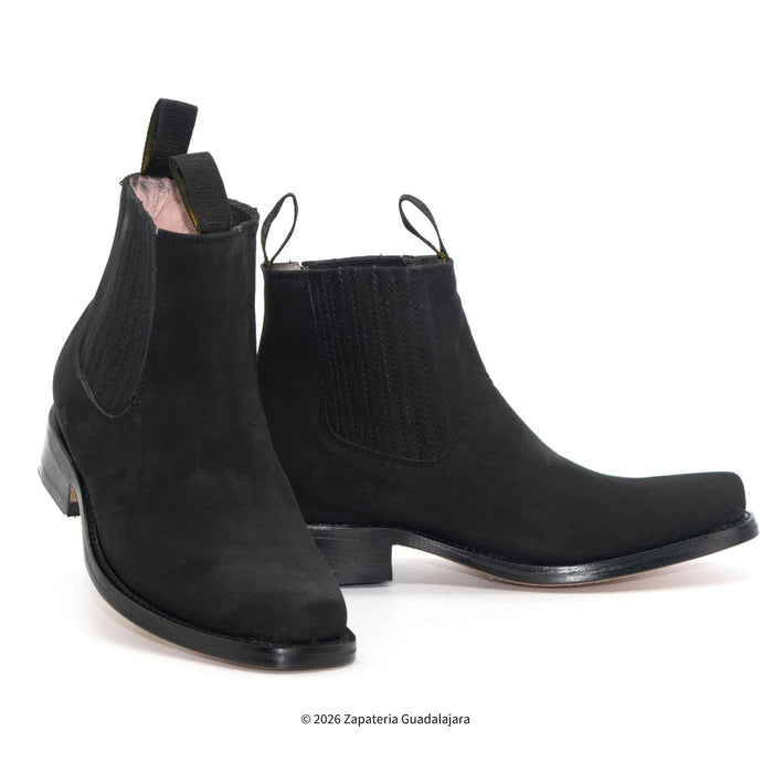 A pair of black suede Chelsea boots with elastic side panels and pull tabs, displayed on a clean white background.