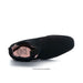 A black suede ankle boot shown from a side profile view on a white background, with a pink insole and a small copyright watermark at the bottom.