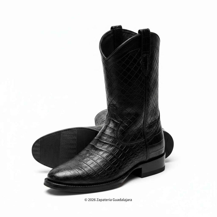 A pair of black crocodile-embossed leather cowboy boots, with one boot standing upright and the other lying flat to show the sole, on a white background.