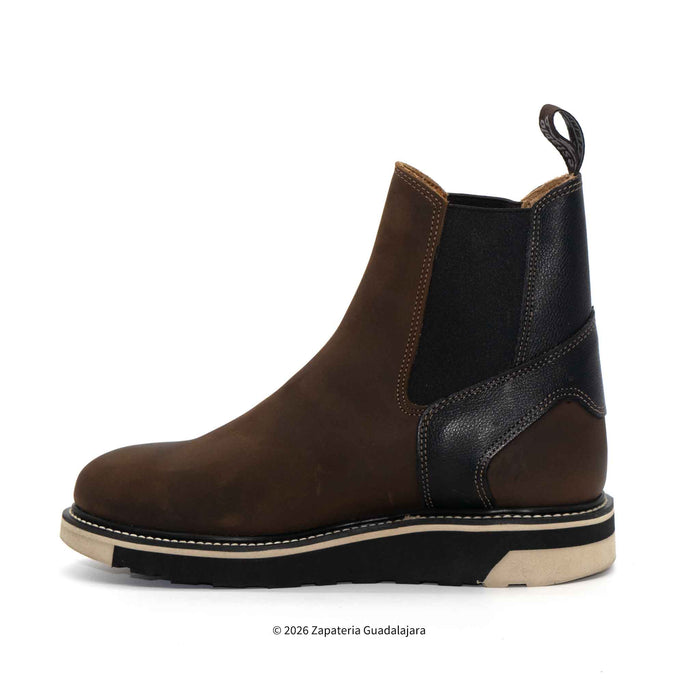 Brown and black leather boot on a white background