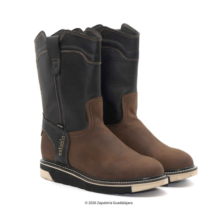 Pair of brown and black boots on a white background
