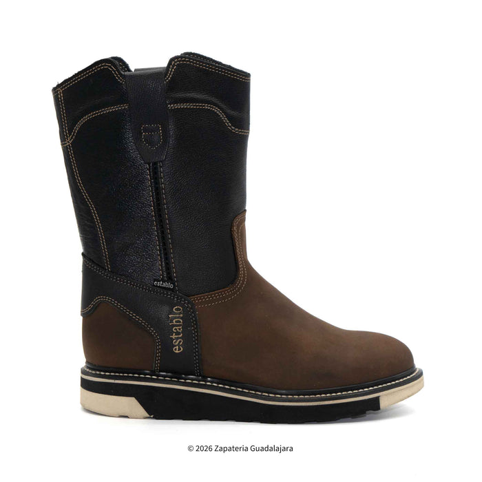 Brown and black cowboy boot with 'estebano' branding on a white background