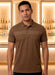 Man wearing a brown polo shirt in a bar setting