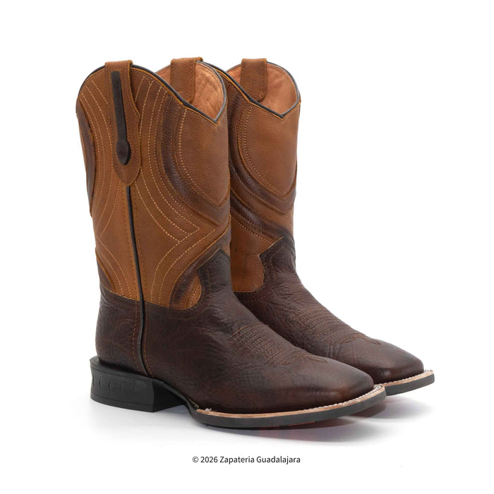 A pair of western cowboy boots in shades of brown, featuring a dark brown textured leather lower section and a lighter tan leather shaft with decorative stitching, shown on a white background.