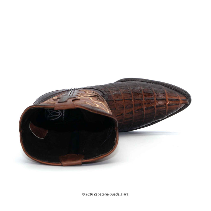 Brown leather boot with detailed pattern on a white background