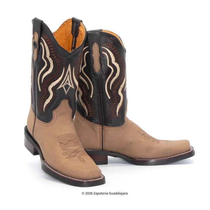 A pair of western cowboy boots in tan and black leather with beige embroidered scrollwork on the shafts, shown against a plain white background.