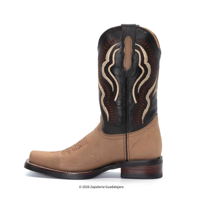 A single western cowboy boot shown in profile against a plain white background. The boot features a tan leather lower section and a black leather shaft with beige and brown embroidered decorative stitching.