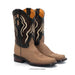 A pair of western cowboy boots in tan leather with black shafts and beige embroidery, shown on a white background.