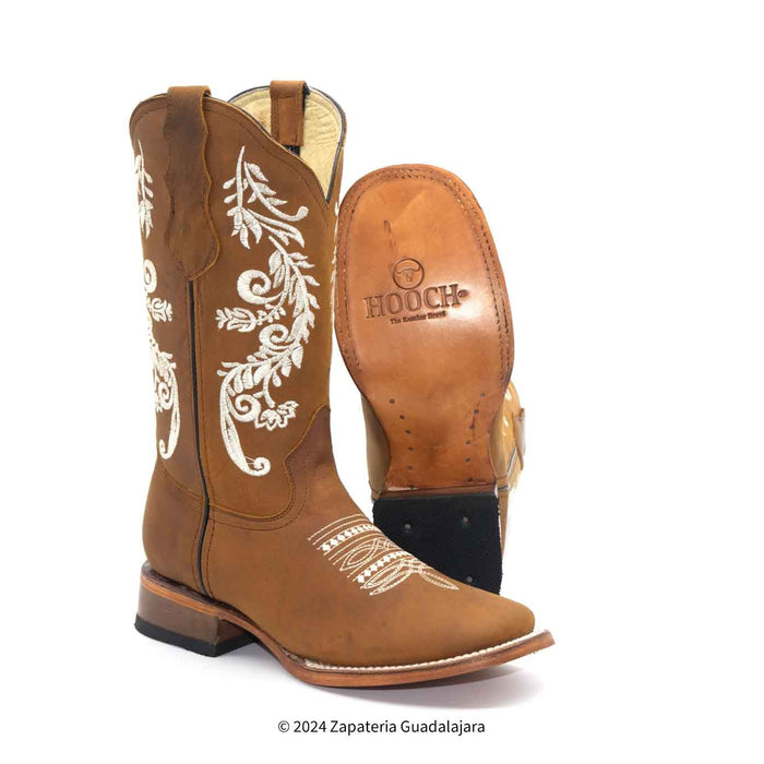 Brown cowboy boots with white embroidery on a white background, featuring the brand 'Hooch'.