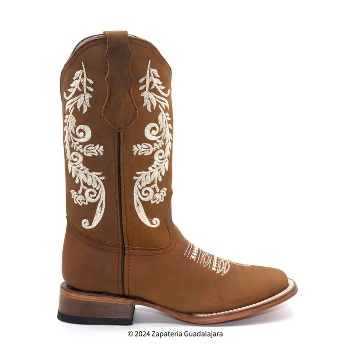 Brown cowboy boot with white embroidery on a white background