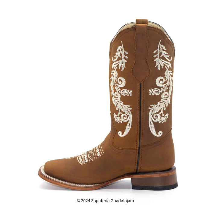 Brown cowboy boot with white embroidery on a white background