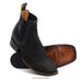 A pair of men's wide square toe faux python black leather cowboy boots.