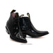 Pair of black leather boots on a white background