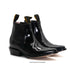 Pair of black leather boots on a white background