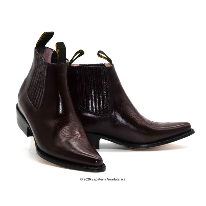 Pair of brown leather boots on a white background