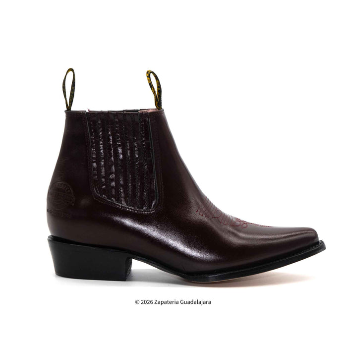 Dark brown leather boot with a pointed toe on a white background