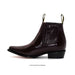 Brown leather boot with a crocodile texture on a white background