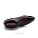 Shiny brown dress shoe on a white background