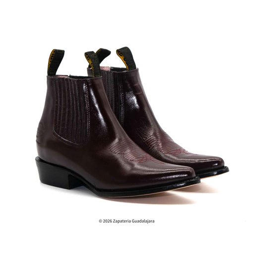 Pair of brown leather boots on a white background