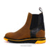 Brown and black boot with yellow sole on a white background