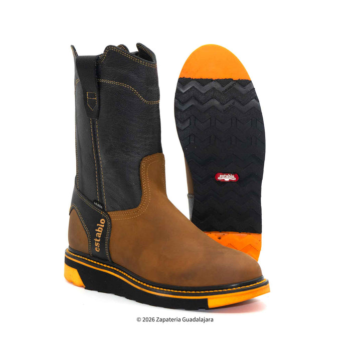 Brown and black boot with orange sole on a white background