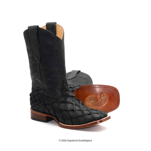 Black quilted leather cowboy boot with brown sole on a white background