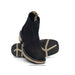 Black cowboy boot with beige sole on a white background