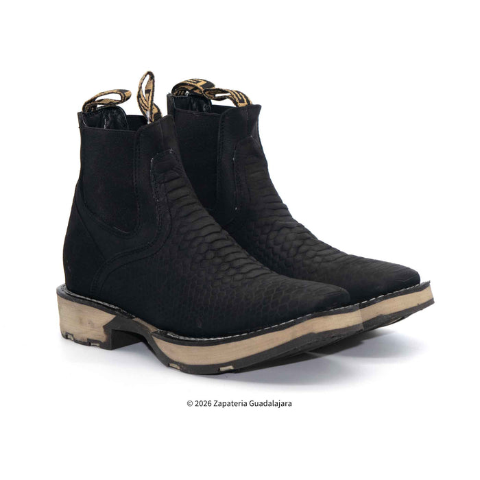 Pair of black boots with a textured pattern on a white background
