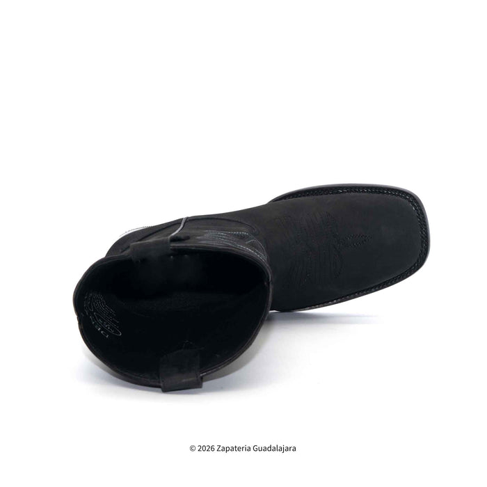Black slip-on shoe on a white background
