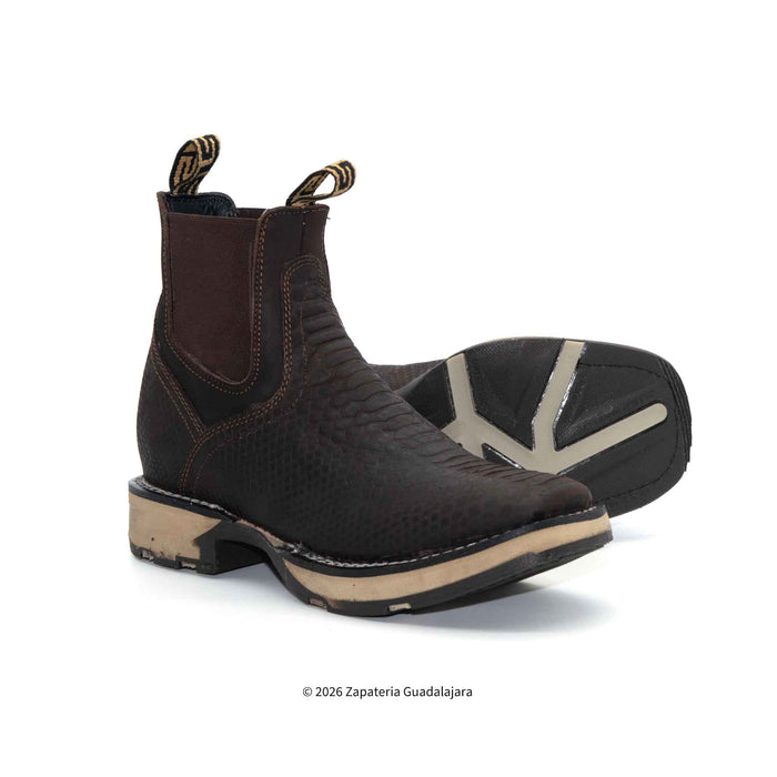 Pair of brown leather boots with beige soles on a white background