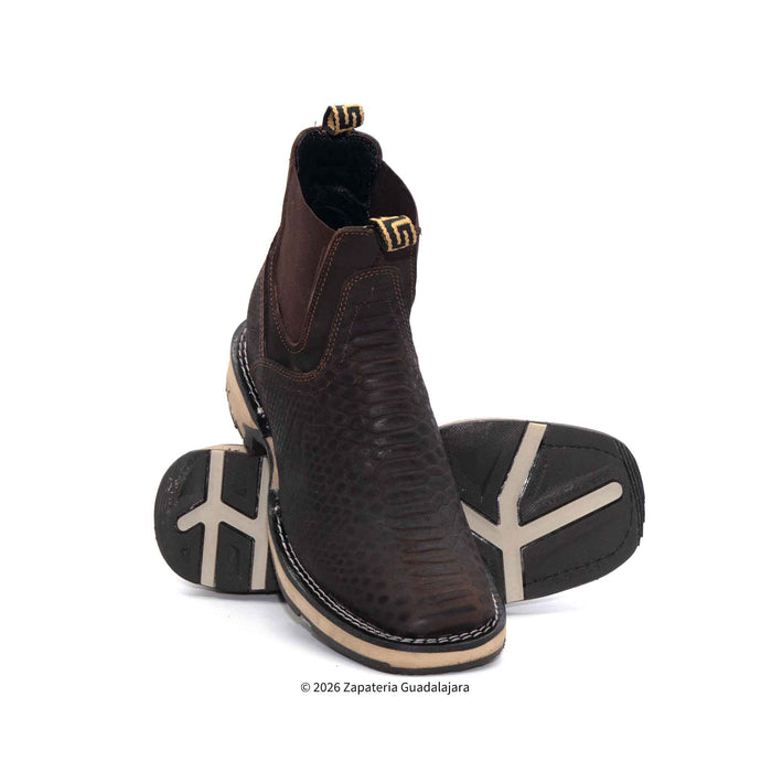 Brown leather boots with beige soles on a white background
