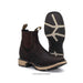 Pair of brown leather boots with beige soles on a white background